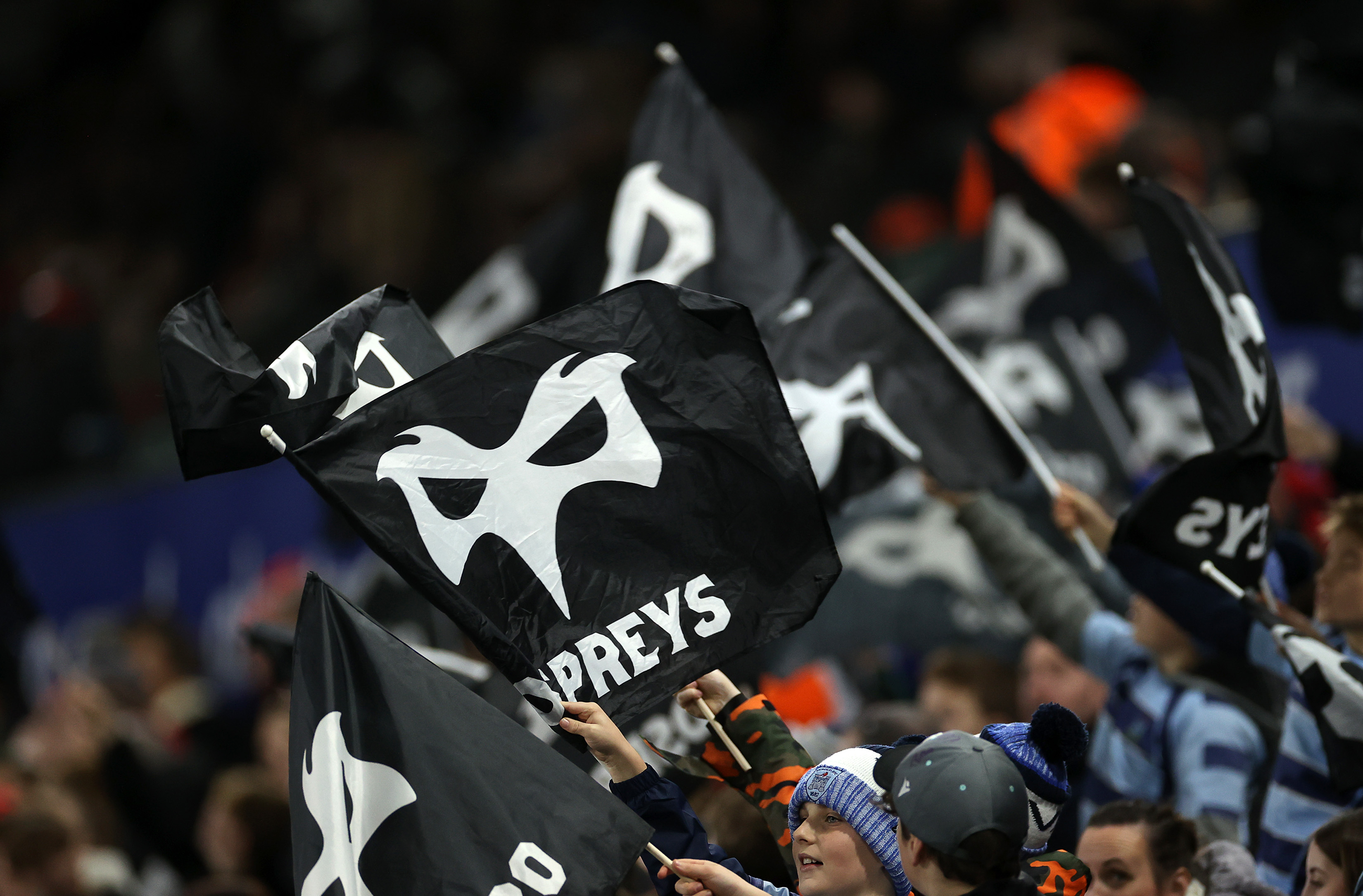 Ospreys fans wave their flags