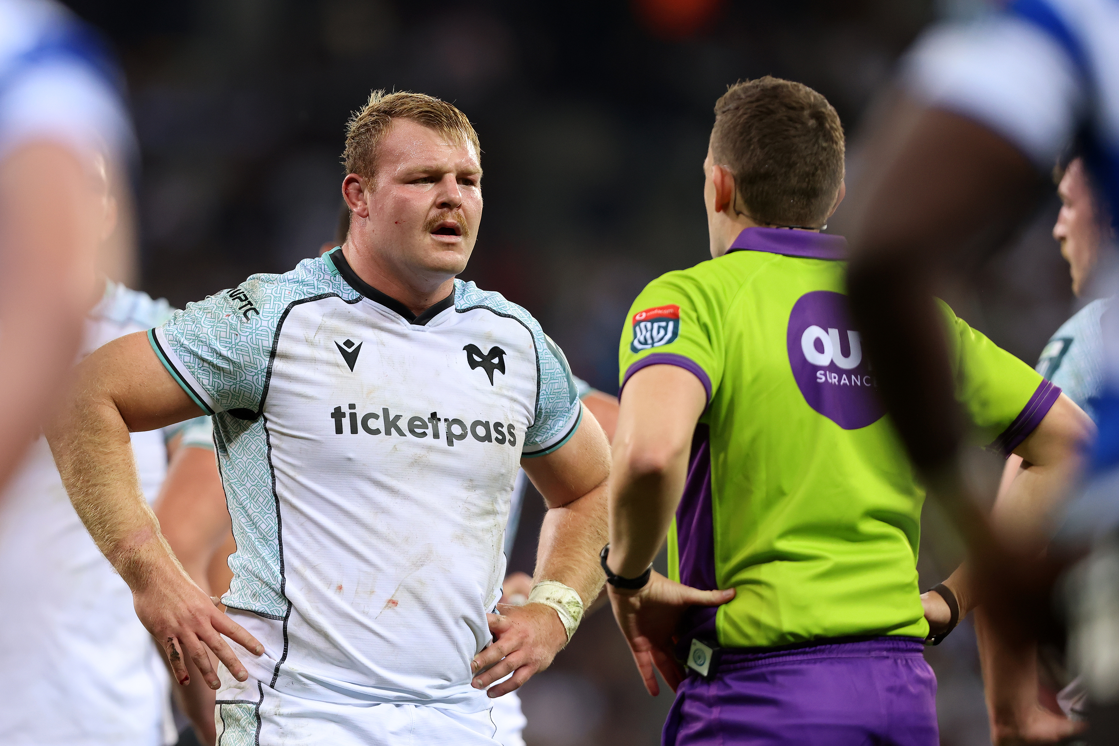 Dewi Lake talks to the referee as he captains the Ospreys 