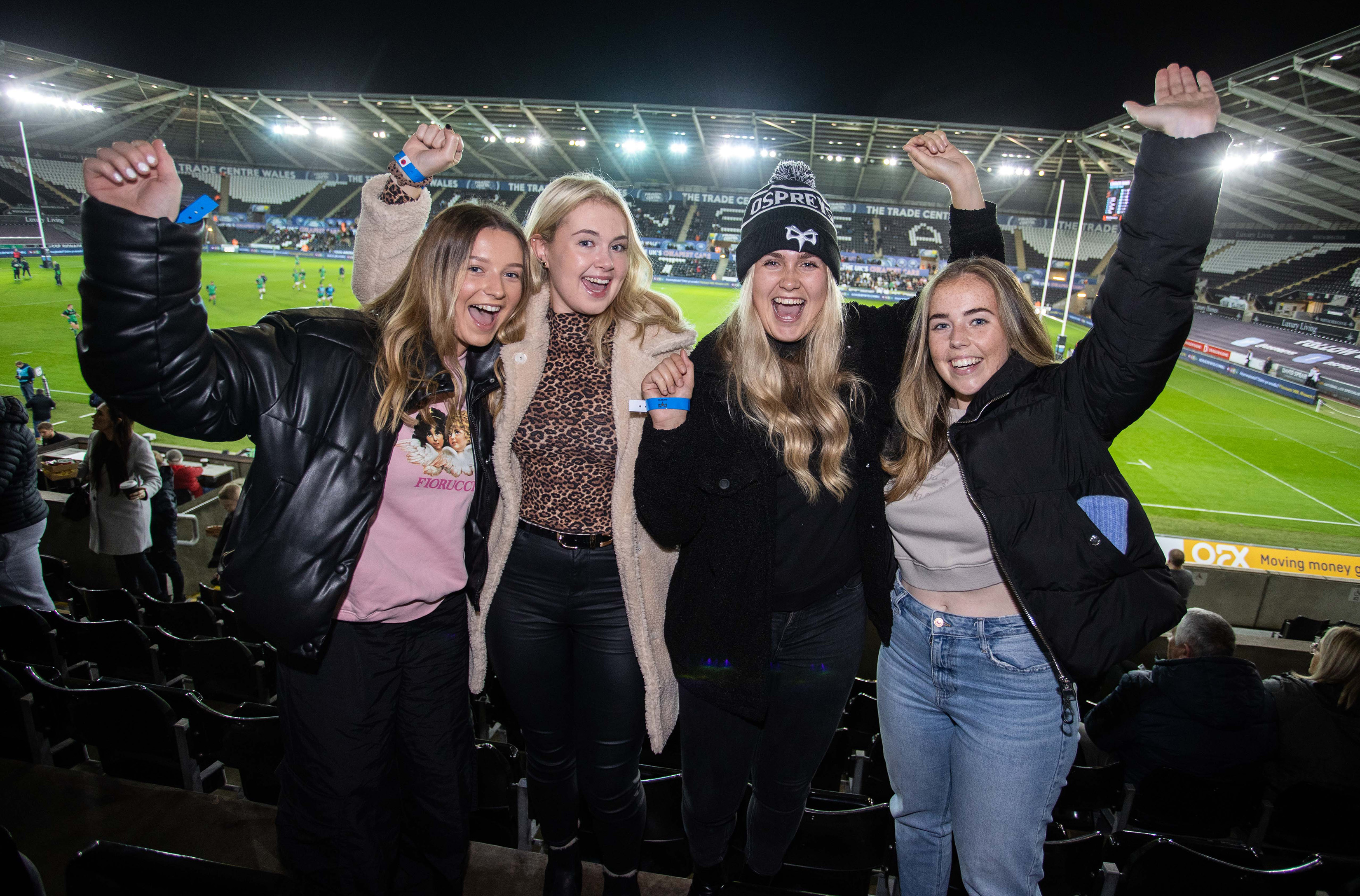A birthday group celebrating in the stands at the Swansea.Com Stadium