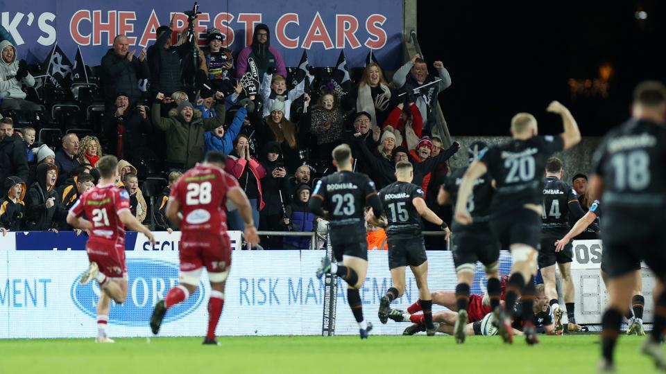 Ospreys celebrate a score over rivals Scarlets at the Swansea.com stadium