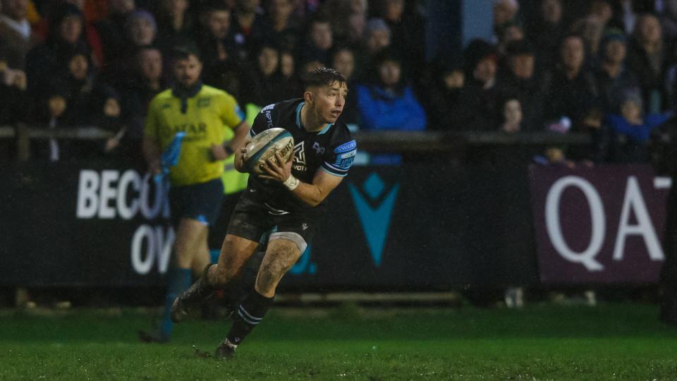 Dan Edwards plays in front of a packed out Brewery Field crowd