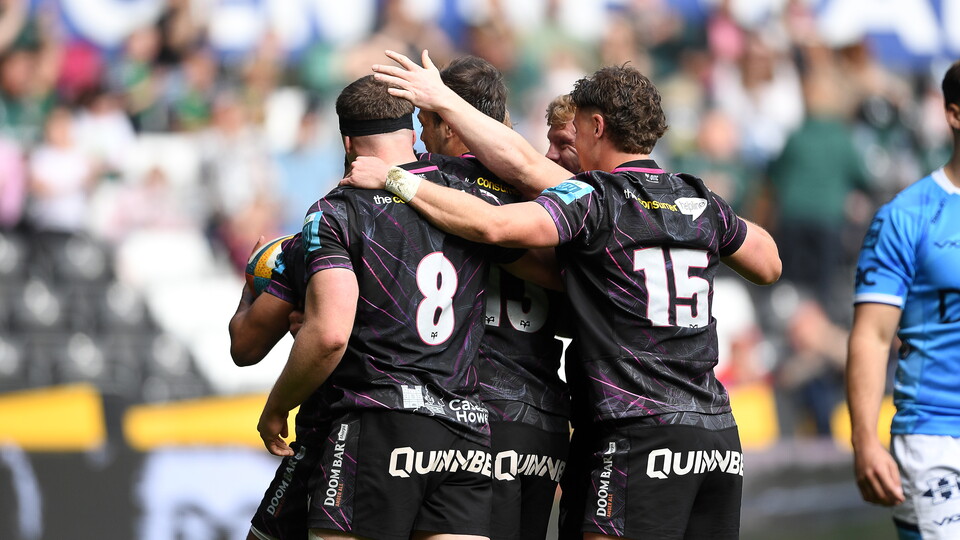 The squad celebrate a try at home vs Dragons in 2025 season