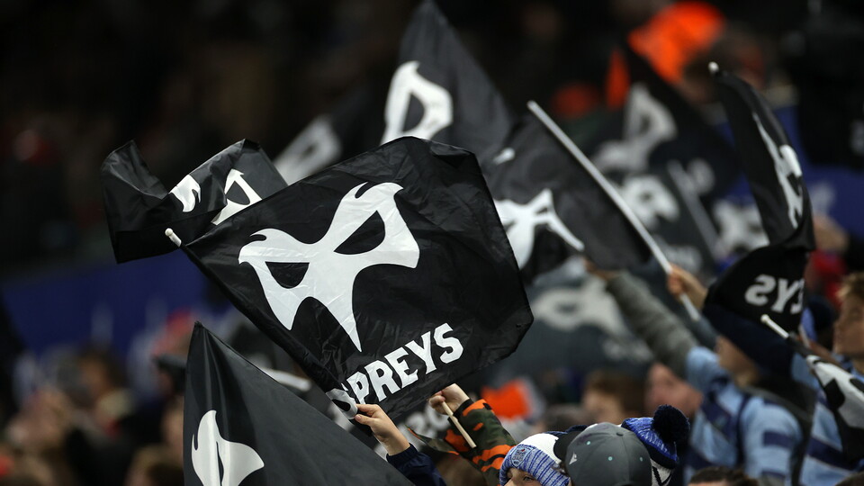 Ospreys fans wave their flags