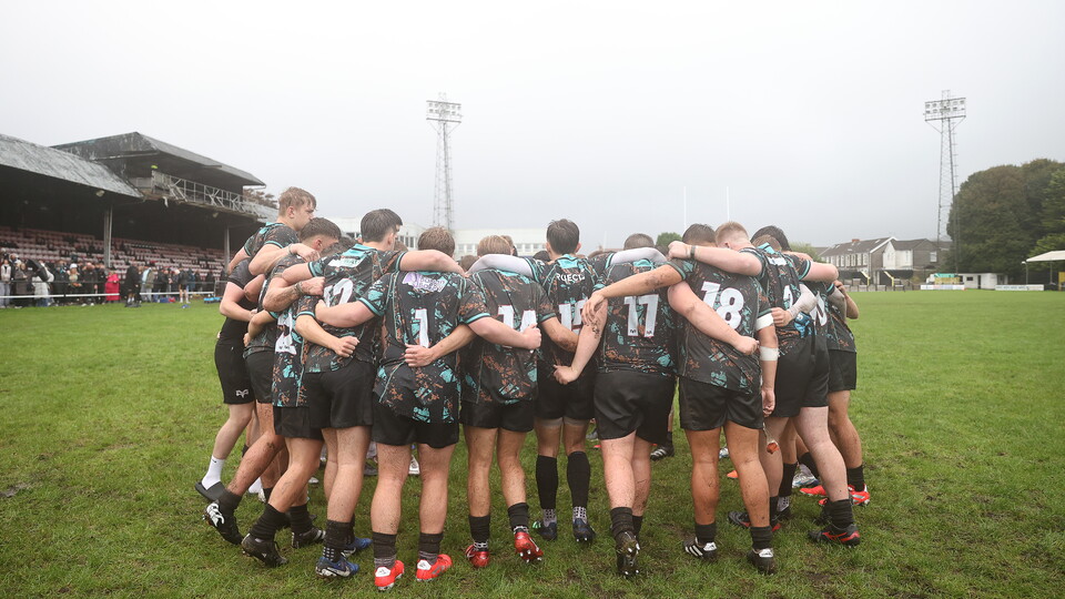 Ospreys u18s huddle on the pitch at the Gnoll, Neath, during their successful 25/26 championship campaign 