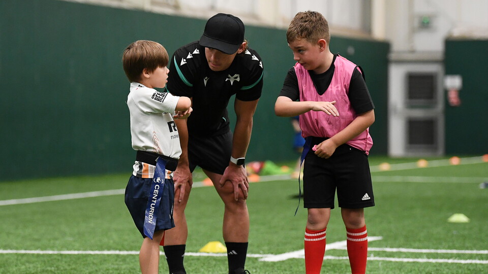 Ospreys scrum-half Harri Williams talks to camp attendees at Llandarcy 
