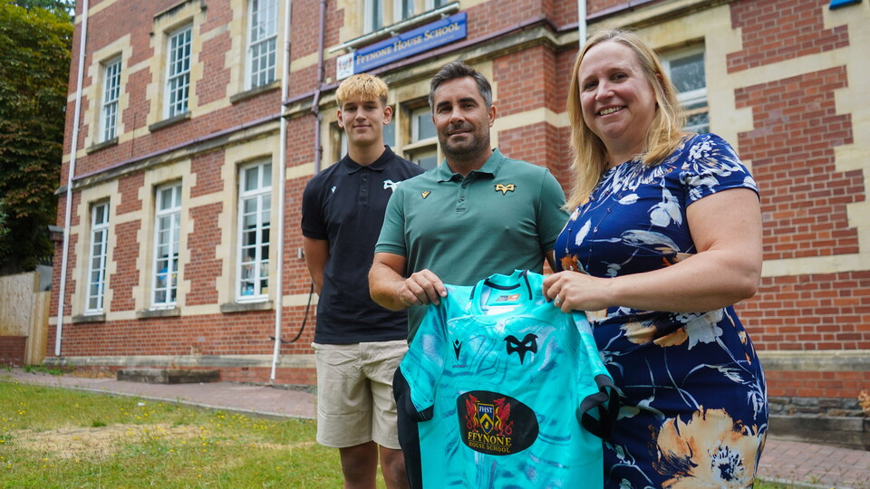 Representatives of Ospreys and Ffynone House school pose for a photo outside the school. 