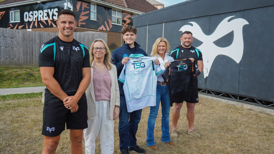 Temporary Solutions Group (TSG) pose for a photo with Ospreys 26/27 Captains Owen Watkin and Sam Parry at the club's Llandarcy Academy of Sport High Performance Centre