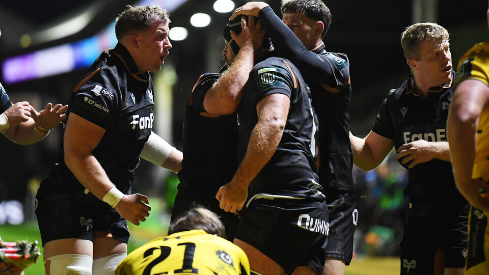 Ospreys players congratulate Morgan Morris as he scores the winning try in Ospreys victory over Dragons in the BKT URC at Rodney Parade, Newport